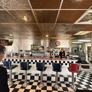 a woman standing at the counter