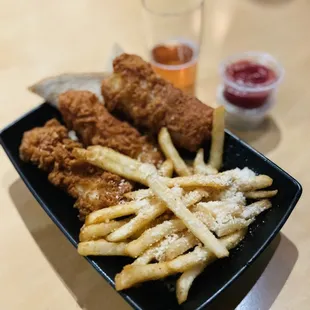 a plate of fried chicken and french fries