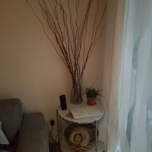 Fully decorated living room includes blue tooth speaker.