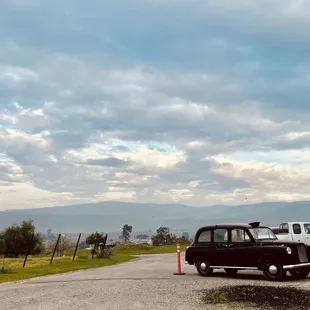 a black car parked in a parking lot