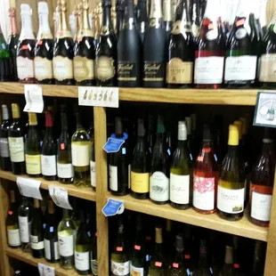 a shelf full of wine bottles