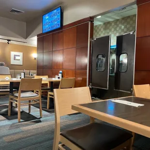 seating and televisions in a restaurant