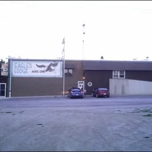 two cars parked in front of the building