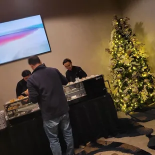 two men serving food