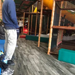 Nice bench area inside the play area for parents to sit and wait .