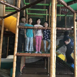 Kids having fun running around , a bit hard to keep track of them though .