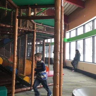 The window being close by does let in some light , but with the metal mesh , it's hard to see through the play area