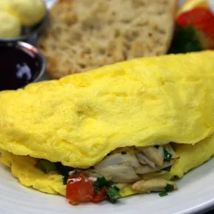 The Reef Omelet with jumbo lump crab, tomato, green onion, chives, boursin cheese, and parmesan cheese