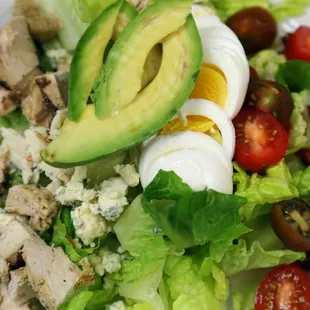 Classic Cobb Salad with mixed lettuces, moody bleu cheese, soft steamed egg, marinated grilled chicken, avocado with your choice of dressing
