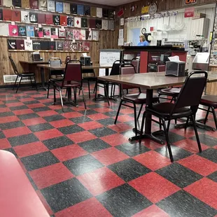 a restaurant with red and black checkered floor
