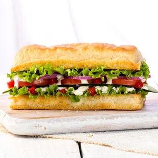 a large sandwich on a cutting board