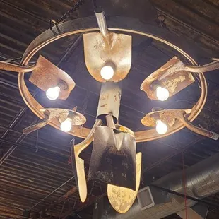 Cool shovel chandelier in the dining room.