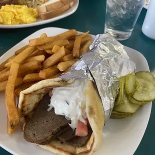a steak sandwich and french fries