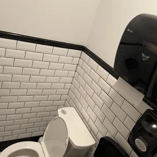 a toilet in a public restroom