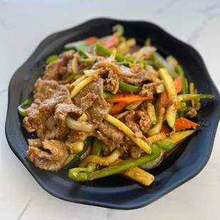 a plate of stir fried vegetables