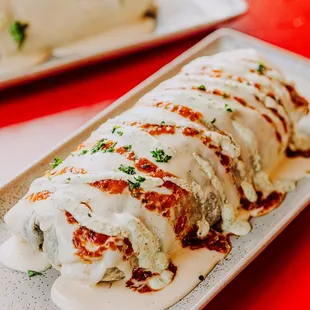 a plate of food on a red table