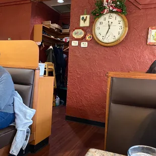 a woman sitting on a couch in a restaurant