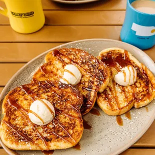 a plate of pancakes and a cup of coffee