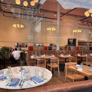 a dining area with tables and chairs