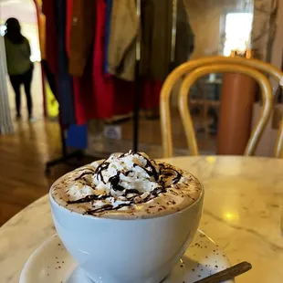 a cup of hot chocolate and whipped cream