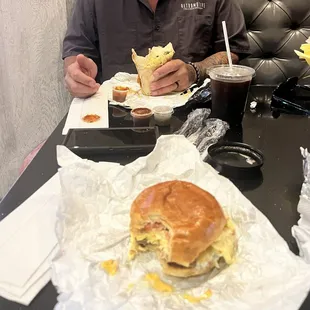 Chicken, sausage, egg, and cheese sandwich and Carne Asada burrito, cold brew, and latte