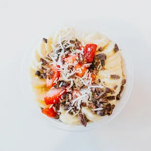 a bowl of fruit and nuts