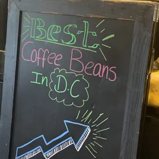 a blackboard with a chalk drawing of a coffee bean