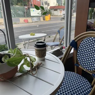a table with a cup of coffee on it
