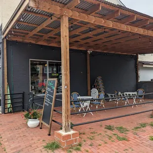 Outdoor seating to the side.