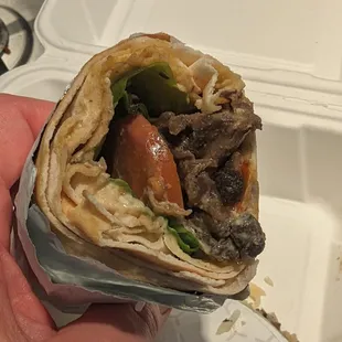 Mushroom wrap ($13) with tomato, arugula, hummus, pickles. Large and tasty.