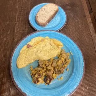Ham and Cheese Omelet, side of sour dough bread, side of warmed brussel sprout hash