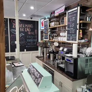 a coffee shop with chalkboard menus