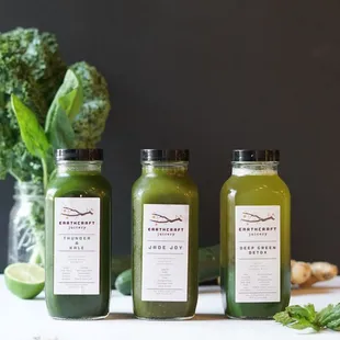 three bottles of green juice