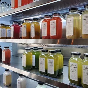 a variety of juices on shelves