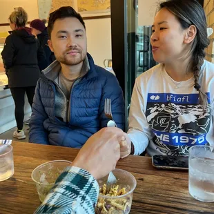 a man and a woman sitting at a table