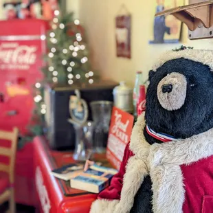 a teddy bear dressed in a santa outfit