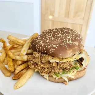 Chicken G's - Naughty Chick -  pepper jack cheese, serrano chili, lettuce &amp; the G sauce on a toasted sesame bun.