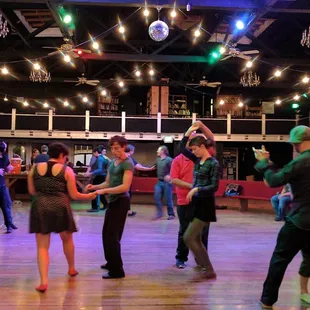 people dancing in a ballroom