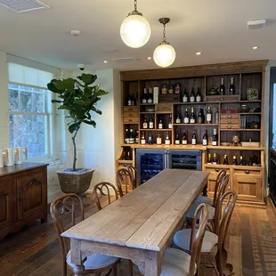 a table and chairs in a wine cellar