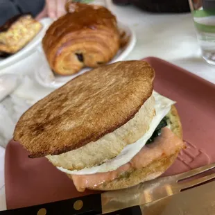 Salmon sandwich with overeasy eggs and spinach