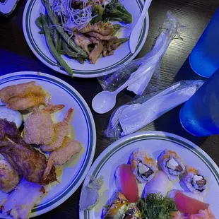 Sushi plate, breaded shrimp, fried fish, chicken skewer, string beans, chicken and broccoli
