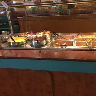 a buffet with a variety of food items