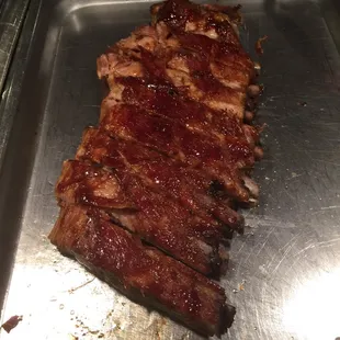 a piece of meat on a metal tray