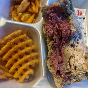 Pastrami cornbeef , and turkey with Swiss cheese, thousand island, dressing , coleslaw on Ryebread and salad, french fries, or soup