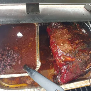 a roasting rack of meat and beans