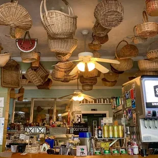 wicker baskets hanging from the ceiling