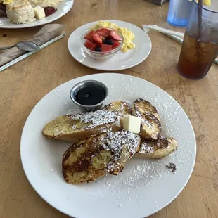 French Toast - $11 Thickly cut French bread served with two eggs scrambled and fresh fruit.