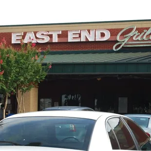 cars parked in front of the restaurant