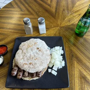 One of the very best meals ever, Cevapi!  Grilled beef links between lepinja (pita type bread) with raw onion.
