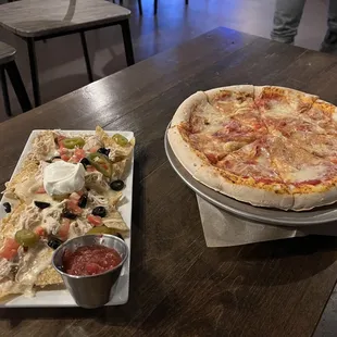 Cheese pizza and chicken nachos